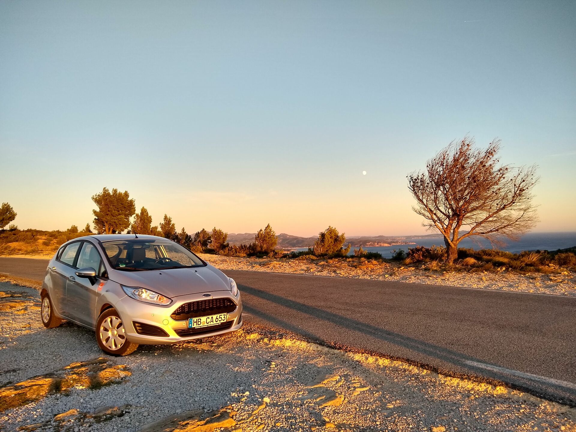 cambio-Auto im Sonnenuntergang